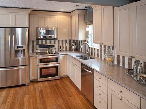 beige kitchen cabinets with stainless steel appliances|white kitchen cabinets beige countertop.